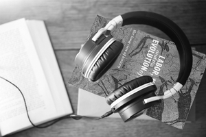  Audio headphones sitting on top of pathfinder book to illustrate audiobooks and other titles for vision impaired 