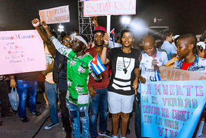  Young South Africans Hold banners and signs at a commemoration to honor Fidel Castro in Santiago de Cuba, December 3, 2016 